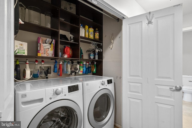 washroom featuring laundry area and washer and clothes dryer