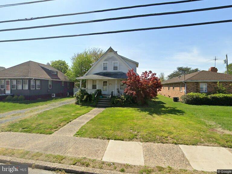 56 W Broad St, Gibbstown, NJ 08027 - view of front of property with covered porch and a front lawn