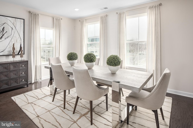 dining area featuring baseboards, recessed lighting, wood finished floors, and visible vents