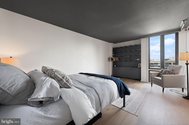bedroom with light wood-type flooring