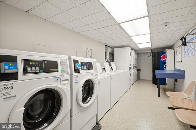 shared laundry with washing machine and clothes dryer and stacked washer and clothes dryer