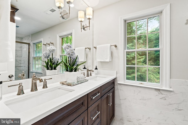 708 W Timber Branch Pkwy, Alexandria, VA 22302 - full bath with a shower stall, double vanity, and a chandelier