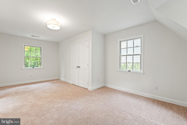 708 W Timber Branch Pkwy, Alexandria, VA 22302 - unfurnished bedroom featuring carpet flooring, baseboards, a closet, and lofted ceiling