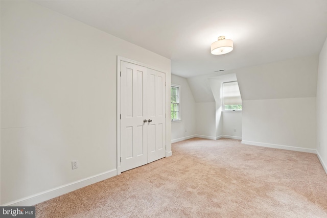 708 W Timber Branch Pkwy, Alexandria, VA 22302 - additional living space with light colored carpet, baseboards, and vaulted ceiling