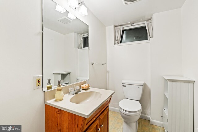 708 W Timber Branch Pkwy, Alexandria, VA 22302 - bathroom featuring toilet, vanity, and baseboards