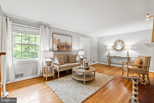 708 W Timber Branch Pkwy, Alexandria, VA 22302 - living area with ornamental molding, light wood-style flooring, and baseboards