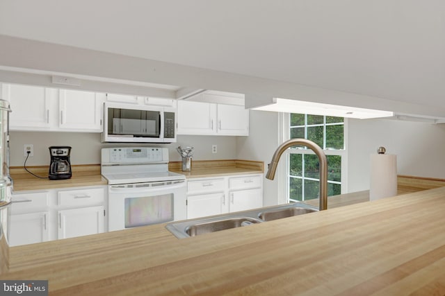73 Mcpherson Cir, Sterling, VA 20165 - kitchen with electric range, a sink, white cabinets, and light countertops