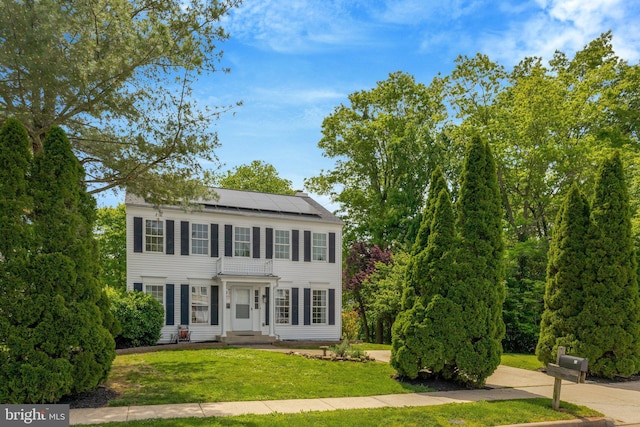 73 Mcpherson Cir, Sterling, VA 20165 - colonial-style house featuring solar panels and a front lawn