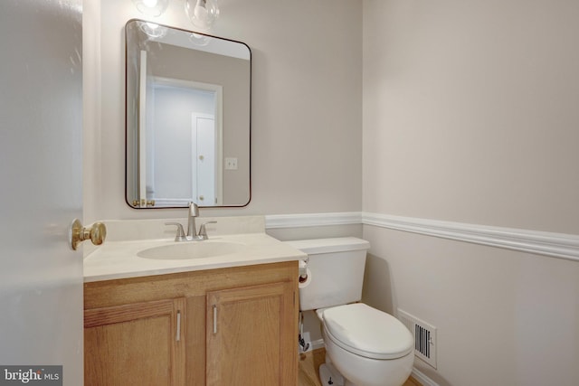 73 Mcpherson Cir, Sterling, VA 20165 - half bathroom featuring vanity, toilet, and baseboards
