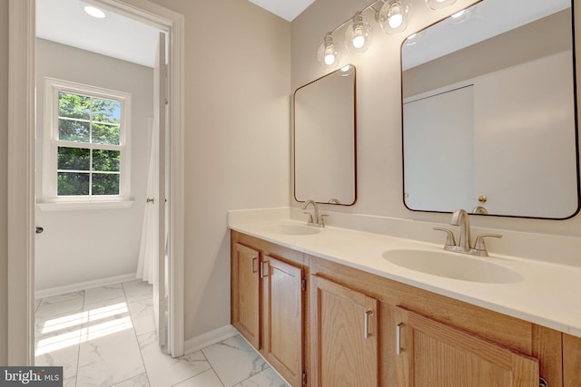 73 Mcpherson Cir, Sterling, VA 20165 - bathroom featuring marble finish flooring, baseboards, and double vanity