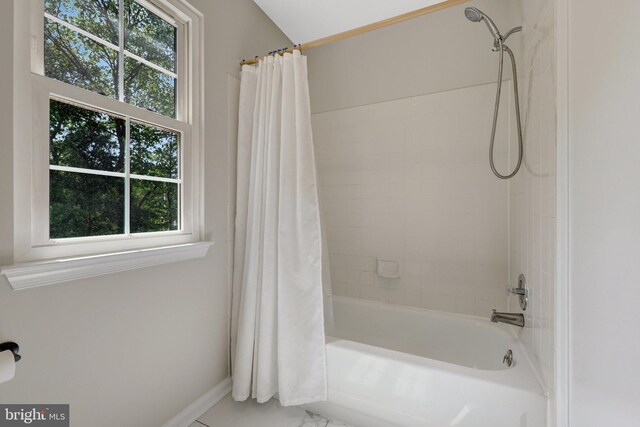 73 Mcpherson Cir, Sterling, VA 20165 - bathroom with healthy amount of natural light, shower / bath combination with curtain, baseboards, and marble finish flooring