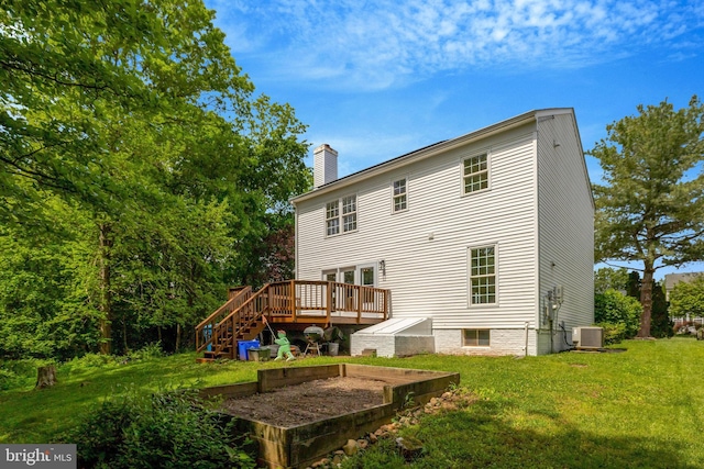 73 Mcpherson Cir, Sterling, VA 20165 - rear view of house with a deck, a chimney, a lawn, central air condition unit, and stairs