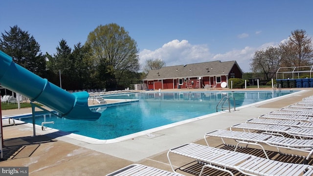 73 Mcpherson Cir, Sterling, VA 20165 - community pool with a water slide, a patio, and fence