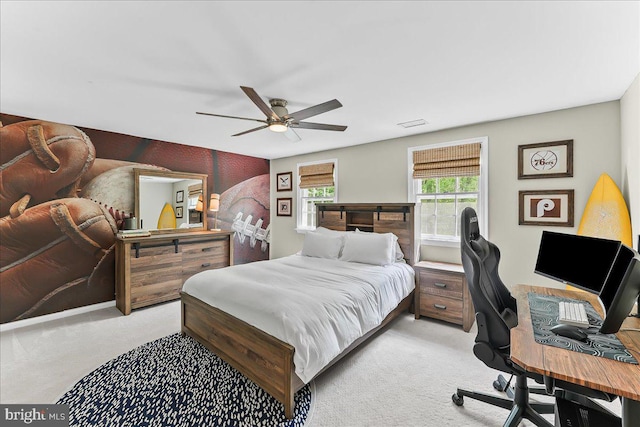 bedroom featuring a ceiling fan and light carpet