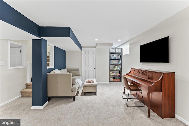 carpeted living area featuring stairway, baseboards, and recessed lighting