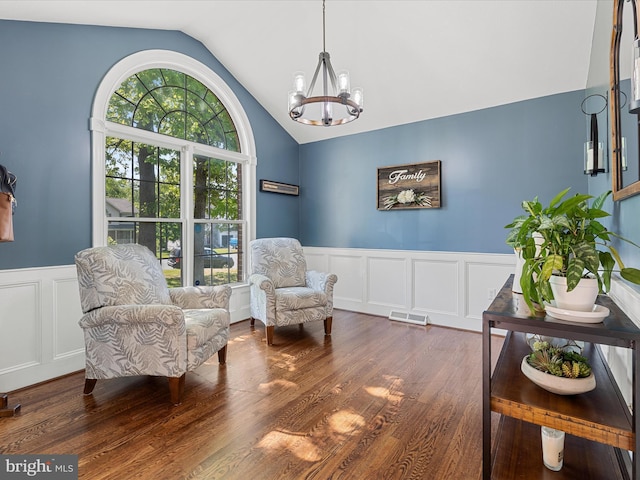 112 Rebels Cir, Winchester, VA 22602 - sitting room with vaulted ceiling, a decorative wall, a chandelier, a wainscoted wall, and wood finished floors