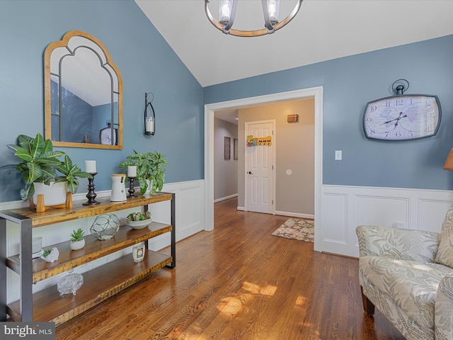 112 Rebels Cir, Winchester, VA 22602 - entryway with wainscoting, wood finished floors, lofted ceiling, a chandelier, and a decorative wall