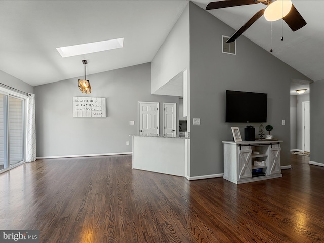 112 Rebels Cir, Winchester, VA 22602 - unfurnished living room with a skylight, high vaulted ceiling, a ceiling fan, dark wood finished floors, and baseboards