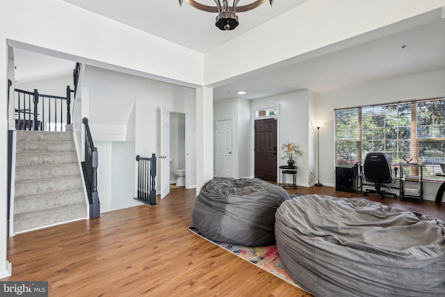 living area with wood finished floors and recessed lighting