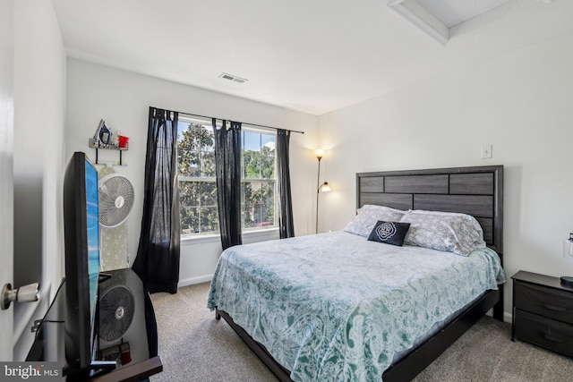 carpeted bedroom featuring baseboards