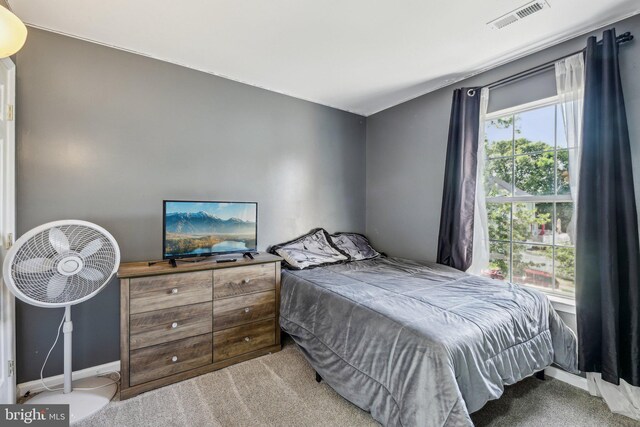 bedroom with carpet and baseboards