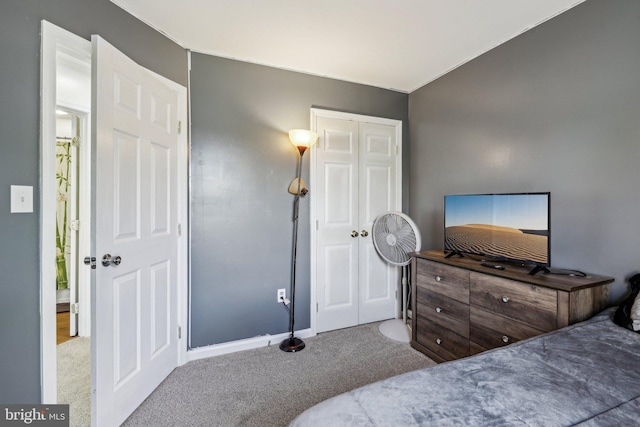 bedroom with carpet flooring and baseboards