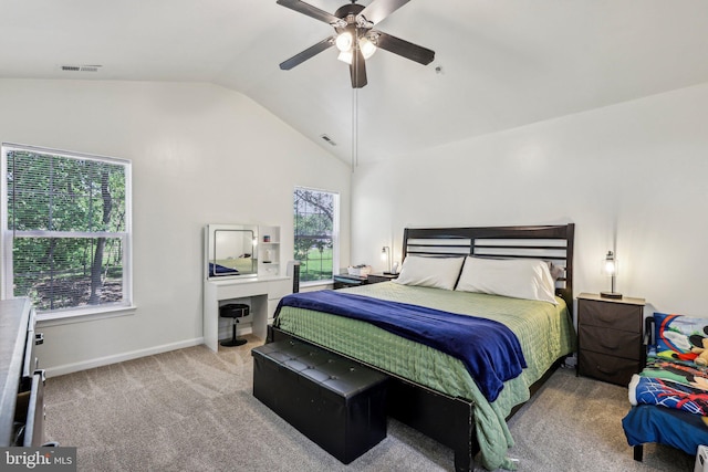 carpeted bedroom featuring vaulted ceiling, baseboards, and a ceiling fan
