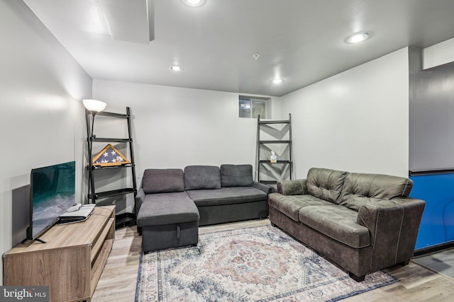living room with light wood-style flooring and recessed lighting