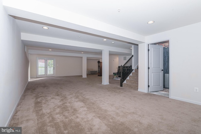basement with stairway, recessed lighting, carpet floors, and baseboards