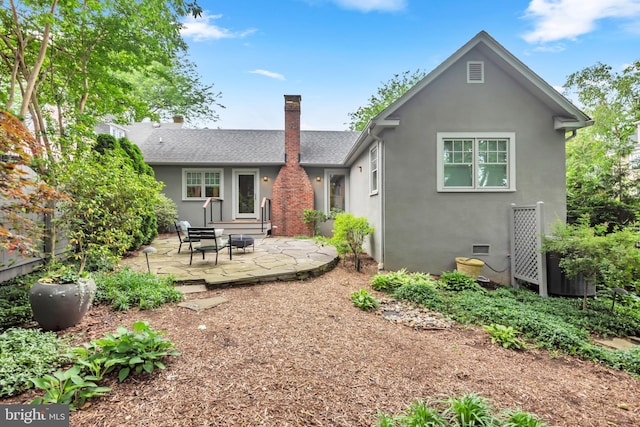 16 Southgate Ave, Annapolis, MD 21401 - back of house with a patio area, stucco siding, a shingled roof, and a chimney