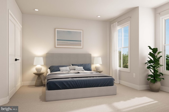 carpeted bedroom featuring baseboards and recessed lighting