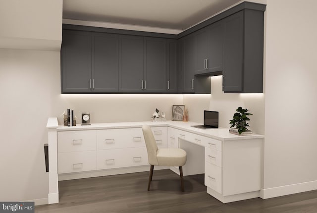 home office with baseboards, dark wood-style flooring, and built in desk