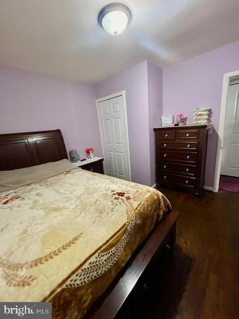 bedroom featuring dark wood-style flooring