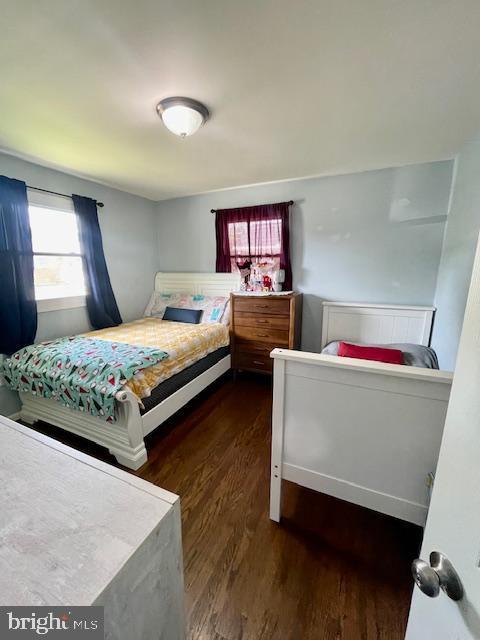 bedroom featuring wood finished floors