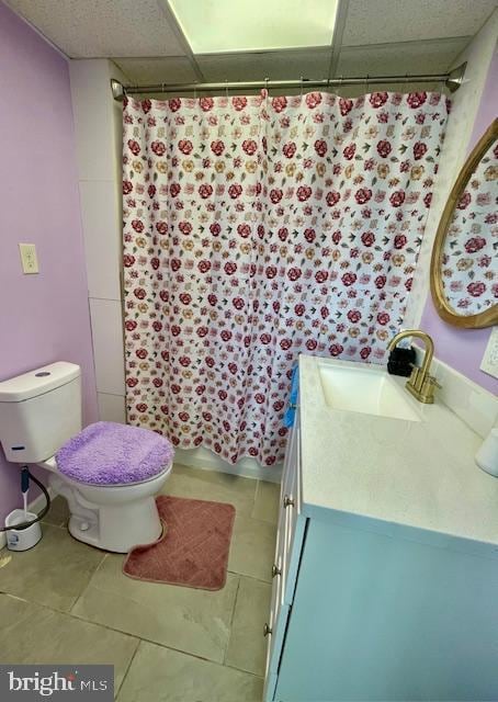 bathroom with vanity, a shower with shower curtain, tile patterned floors, and toilet
