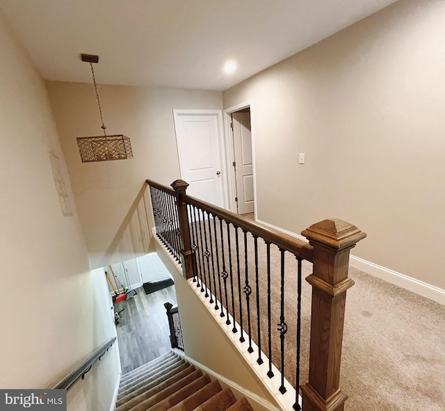 stairway featuring recessed lighting and baseboards