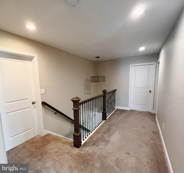stairs featuring baseboards, recessed lighting, and carpet