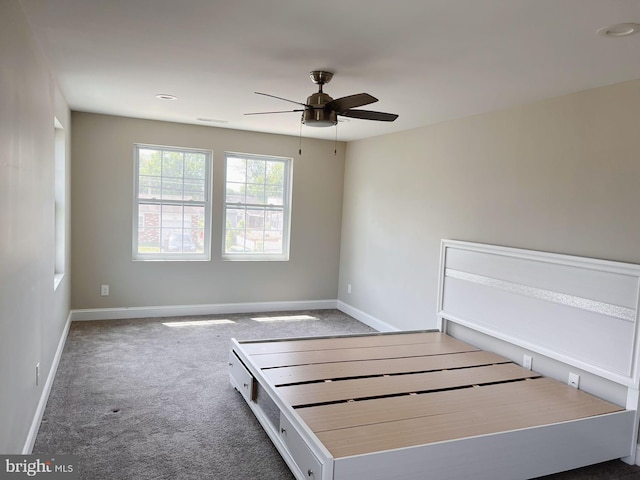 unfurnished bedroom featuring carpet floors, baseboards, a ceiling fan, and recessed lighting