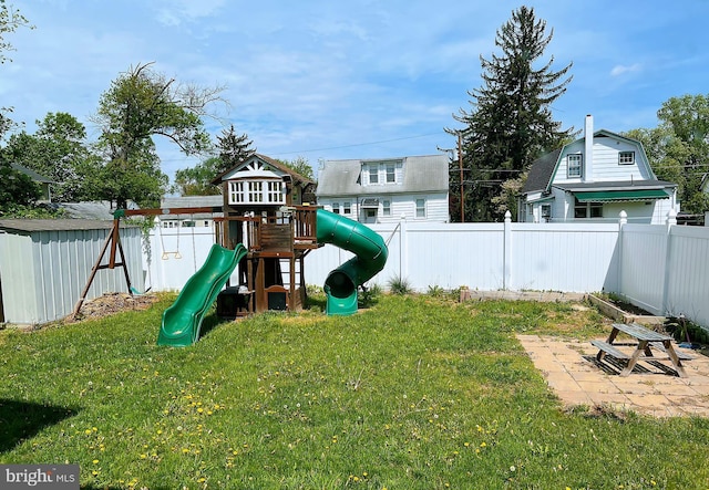 view of jungle gym featuring a fenced backyard and a yard