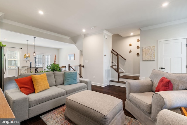 18095 Red Mulberry Rd, Dumfries, VA 22026 - living area with recessed lighting, dark wood finished floors, baseboards, ornamental molding, and stairway
