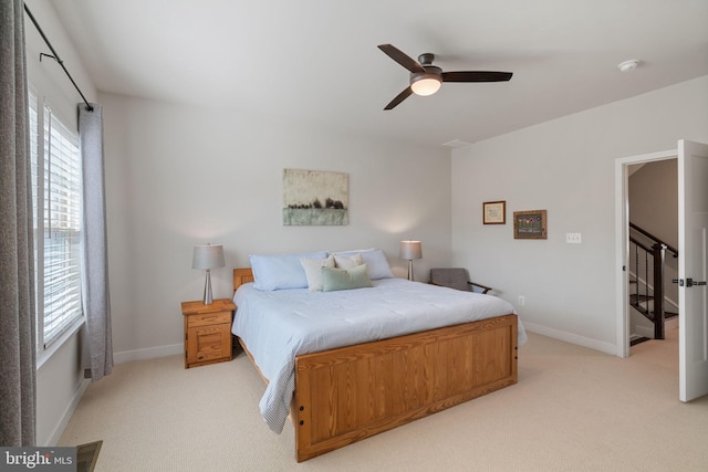 18095 Red Mulberry Rd, Dumfries, VA 22026 - bedroom featuring light carpet, baseboards, and a ceiling fan