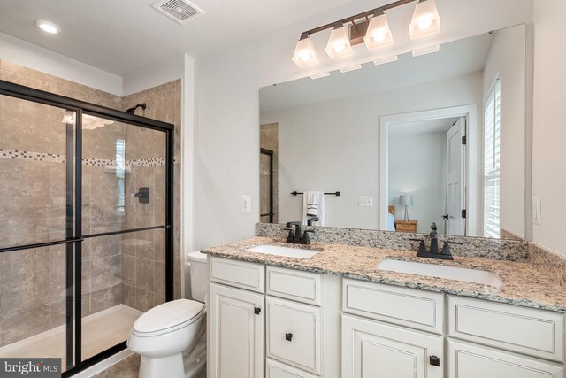 18095 Red Mulberry Rd, Dumfries, VA 22026 - full bathroom with a shower stall, double vanity, toilet, and recessed lighting