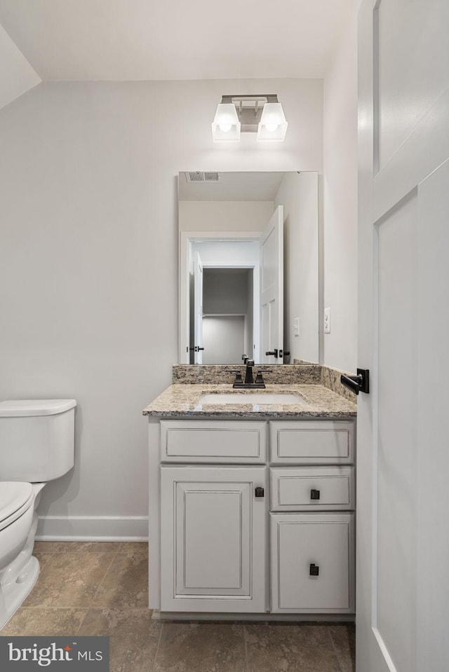 18095 Red Mulberry Rd, Dumfries, VA 22026 - bathroom featuring toilet, baseboards, and vanity