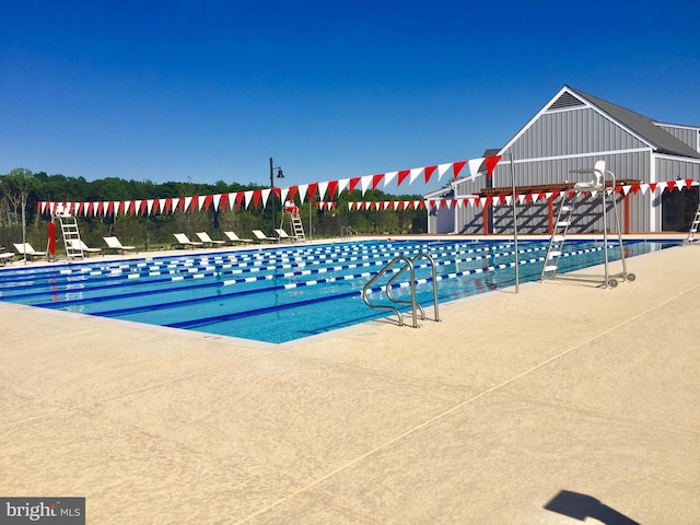 18095 Red Mulberry Rd, Dumfries, VA 22026 - community pool featuring a patio
