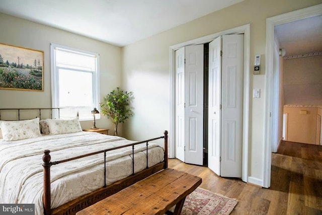 bedroom with wood finished floors