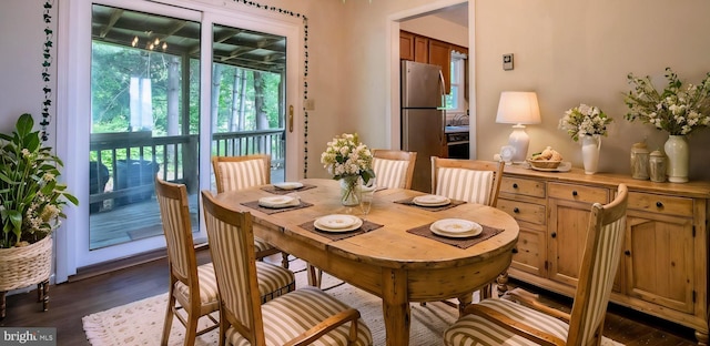 dining space featuring dark wood finished floors