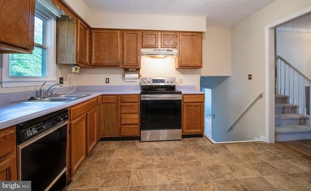 kitchen featuring stainless steel electric stove, dishwasher, under cabinet range hood, a sink, and brown cabinets