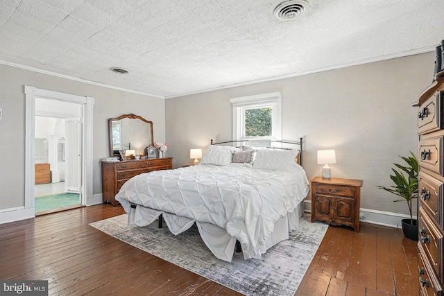 bedroom with baseboards, ornamental molding, visible vents, and dark wood-type flooring