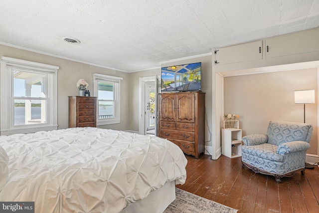 bedroom with visible vents, crown molding, access to outside, and hardwood / wood-style floors