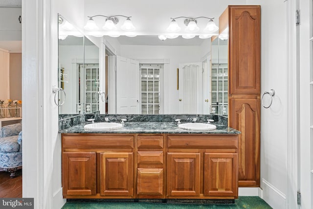 bathroom featuring double vanity and a sink